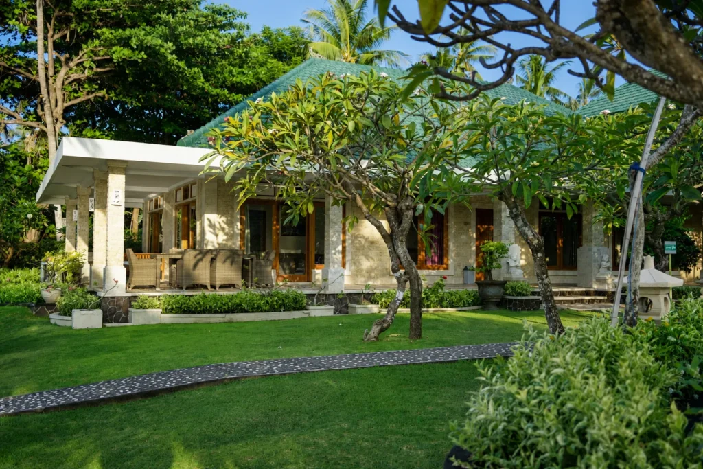 Exterior of the Family Villa with a green tiled roof and lawn