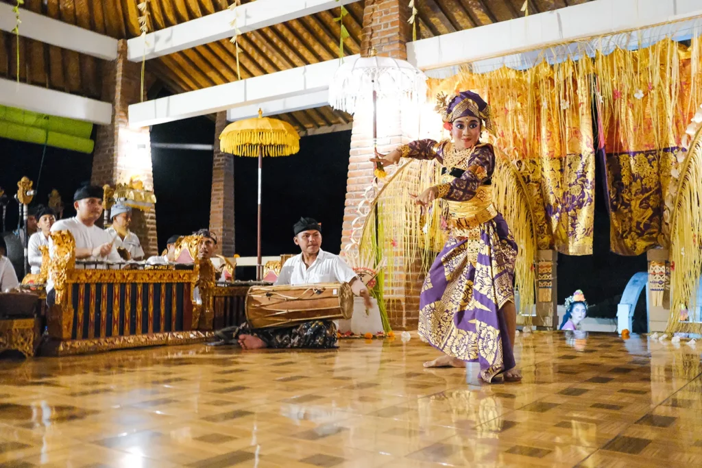 Balinese dancer performing with a gamelan orchestra