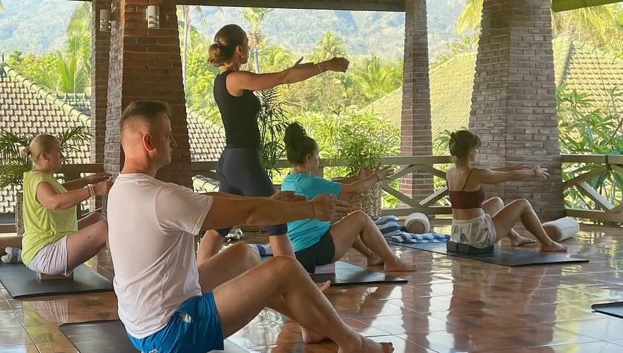 Yoga class in the open-air shala